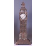 A Victorian brass table clock modelled as Big Ben, having a single white enamel dial with eight