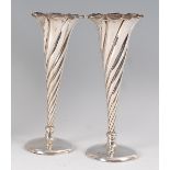 A pair of late Victorian silver specimen vases, each of spiral reeded tapering conical form, on