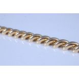 An 18ct yellow gold diagonal curved bar bracelet, with box clasp and figure of eight safety catch,
