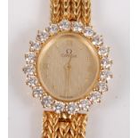 An 18ct yellow gold lady's Omega quartz wristwatch, the watch having an oval quarter Roman dial with