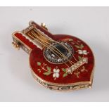 An early 19th century yellow metal lady's full hunter fob watch in the form of a lute, having red