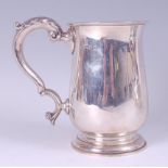 A silver bell shaped tankard, in the mid-18th century style, having acanthus leaf capped flying S-