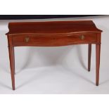 A 19th century mahogany serpentine front single drawer ledgeback serving table, having chamfered