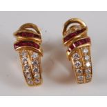 A pair of contemporary 22ct gold, ruby and diamond set earrings, arranged as two rows of graduated