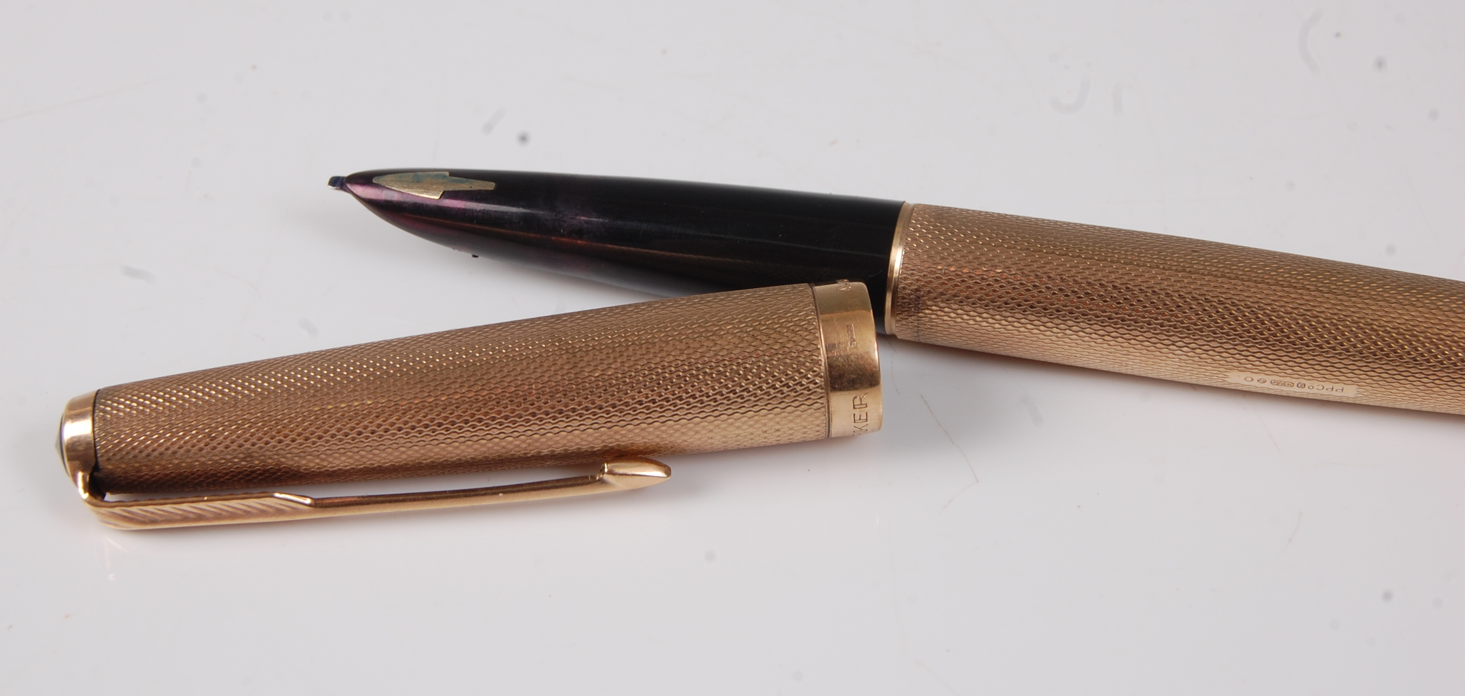 A Parker 61 9ct engine turned gold fountain pen, the case with vacant ...