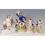 A Victorian Staffordshire figure of a gentleman, in seated pose with bird in hand and gun dog at his