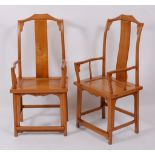 A pair of Chinese 'elm' panelled seat splatback open elbow chairs, having low stretchers, w.57.5cm