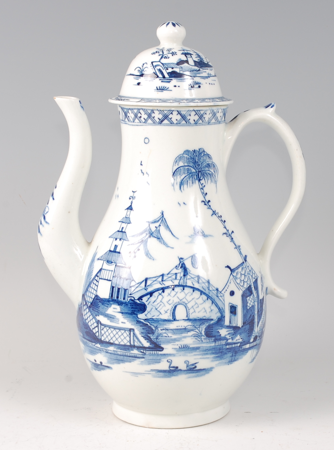 A Lowestoft porcelain coffee pot and cover, circa 1770-72, underglaze blue painted with an
