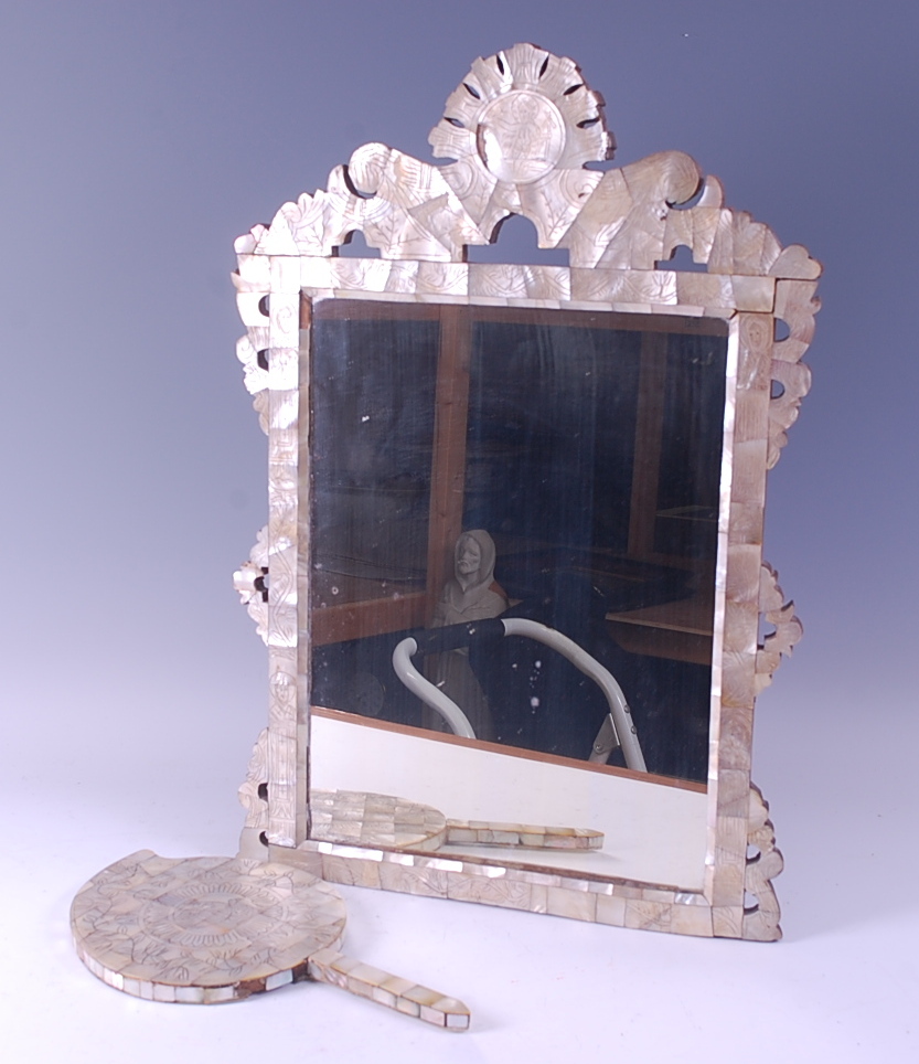 A mother of pearl parquetry easel mirror, having stencilled details of religious figures, h.60cm;