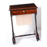 A George IV rosewood needlework table, having a single frieze drawer over a pleated and silk lined