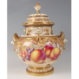 A Royal Worcester porcelain pedestal vase and cover, having pierced neck and applied handles, the