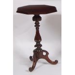 An early Victorian rosewood octagonal topped fixed pedestal tripod table, on a floral carved