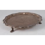 A George II silver card waiter, having a raised piecrust rim, 7.5oz, maker John Tuite, London