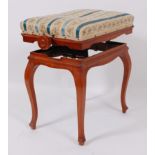 A circa 1900 satinwood and inlaid music stool, the upholstered seat with rise-and-fall action, the