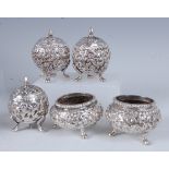 19th century Indian silver cruets, comprising two table salts, a pair of pepperettes, and a
