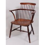 A circa 1840 Thames Valley elm seat and ash comb-back Windsor chair, raised on turned supports