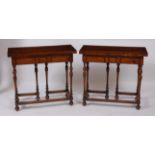 A pair of oak tea tables, in the 17th century style, each having fold-over tops on slender turned