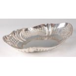 An Edwardian silver dish, of pierced and shaped oval form, with four cut roundels, 12.7oz, maker