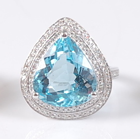 A white gold, blue topaz and diamond pear shaped cluster ring, comprising a centre pear cut blue