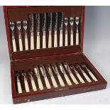 A cased set of twelve Edwardian silver bladed fish knives and forks, each with bright cut