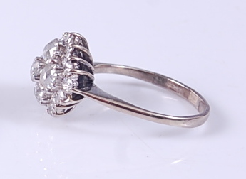 A white metal diamond circular cluster ring, featuring a centre round brilliant cut diamond with two - Image 2 of 2