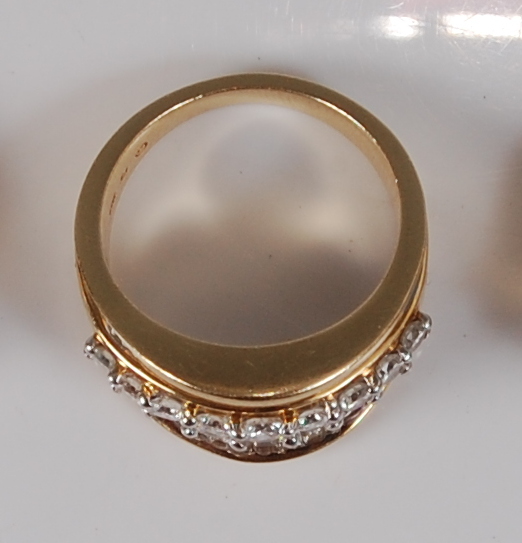 A contemporary 14ct gold diamond dress ring, arranged as a centre row of nine four-claw set - Image 2 of 3