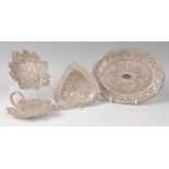 Indian silverware, comprising heart shaped bonbon dish decorated with wild animals and birds,