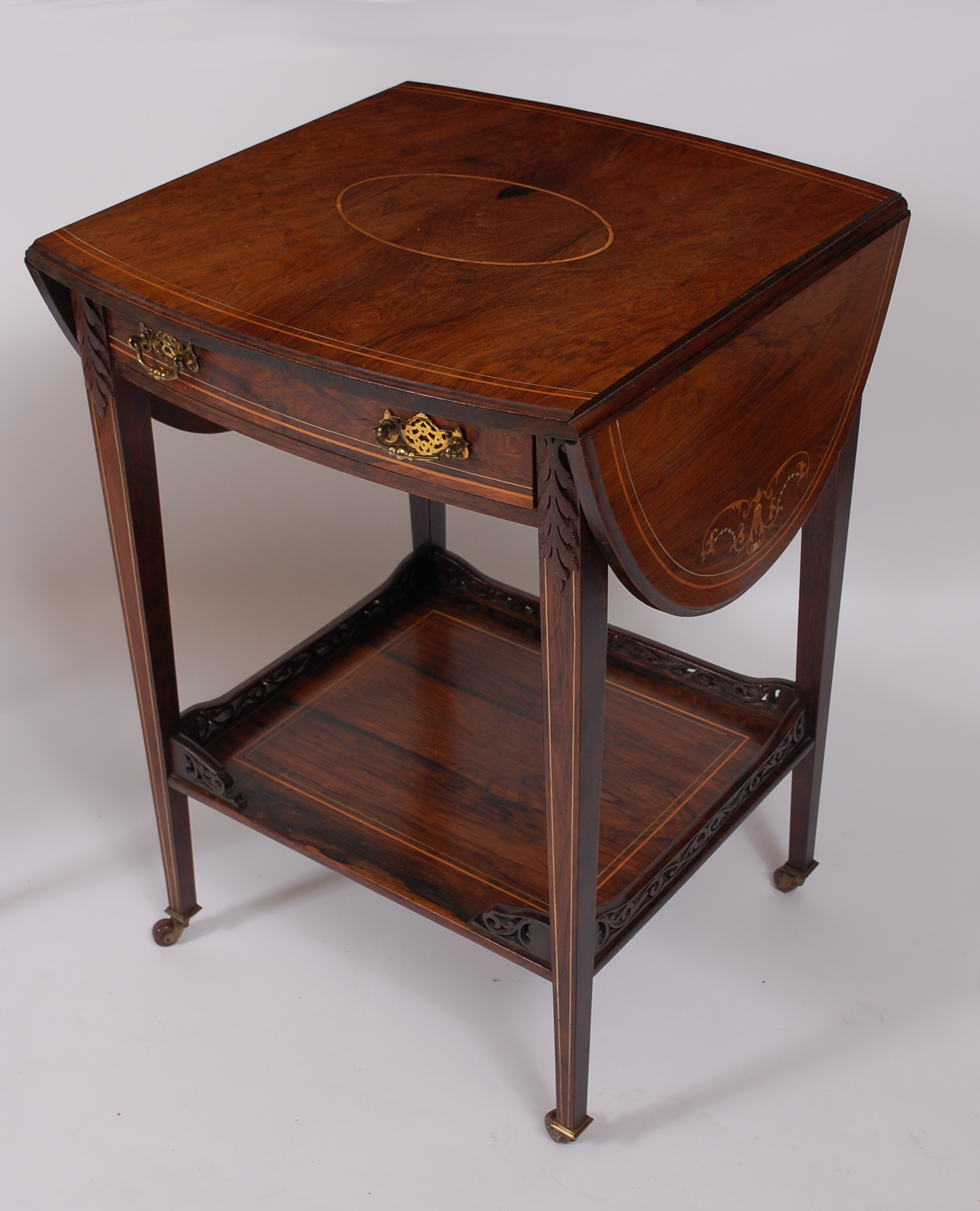 A Sheraton Revival rosewood and marquetry inlaid two-tier occasional table by Maple & Co, the oval