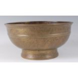 A 19th century Tibetan bronze bowl, engraved with panels of symbols, flowers and foliage, to a