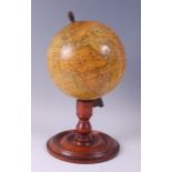 An E.J. Arnold & Son of Leeds educational terrestrial globe, on turned mahogany stand, early 20th