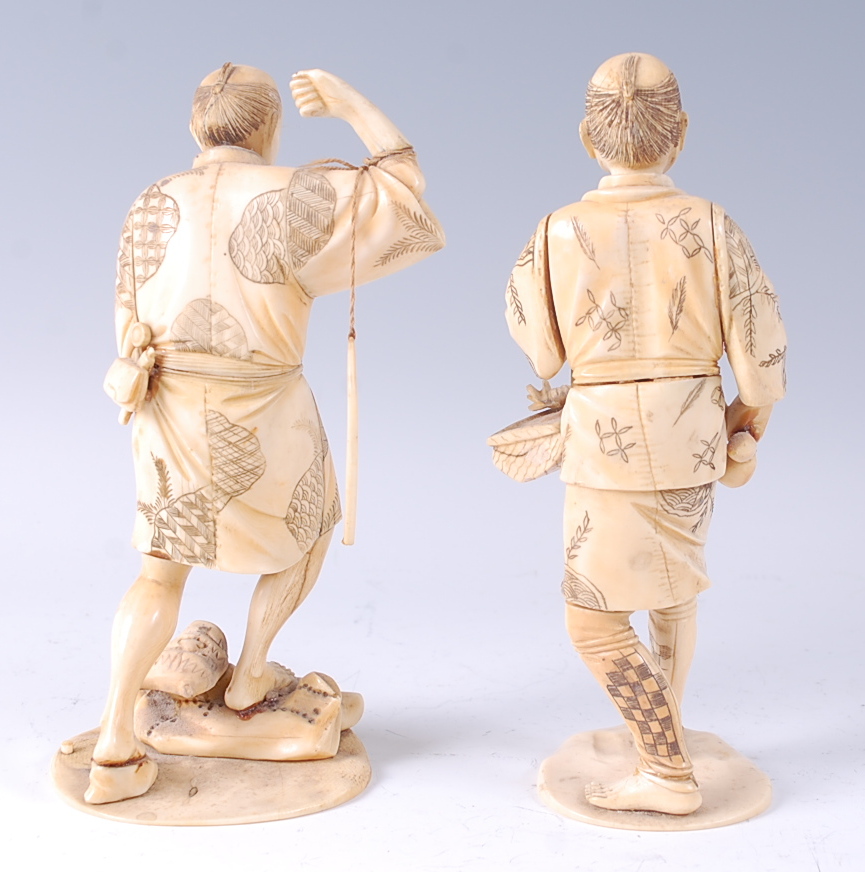 A Japanese Meiji period carved ivory and penwork decorated okimono, of a fisherman in standing pose, - Image 2 of 4