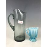 A Victorian blue and orange jug together with a 1960s free-blown glass jug