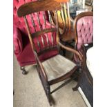 A Victorian rosewood-scumbled rocking chair, (a/f)
