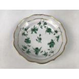 A late 18th Century Bristol (Cookworthy and Champions) porcelain saucer, hand-enamelled with emerald
