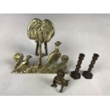 Brassware including a hearth ornament, a pair of miniature candlesticks / taper sticks and a