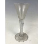 A mid 18th century multiple spiral air twist wine glass (foot chipped)