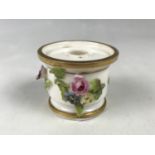 An early 19th Century floral encrusted and gilded porcelain ink pot, having an underglaze blue