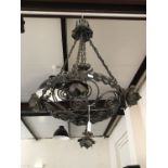An Arts and Crafts wrought iron pendant ceiling light / corona