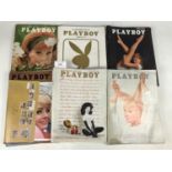 Eleven 1960s issues of Playboy magazine