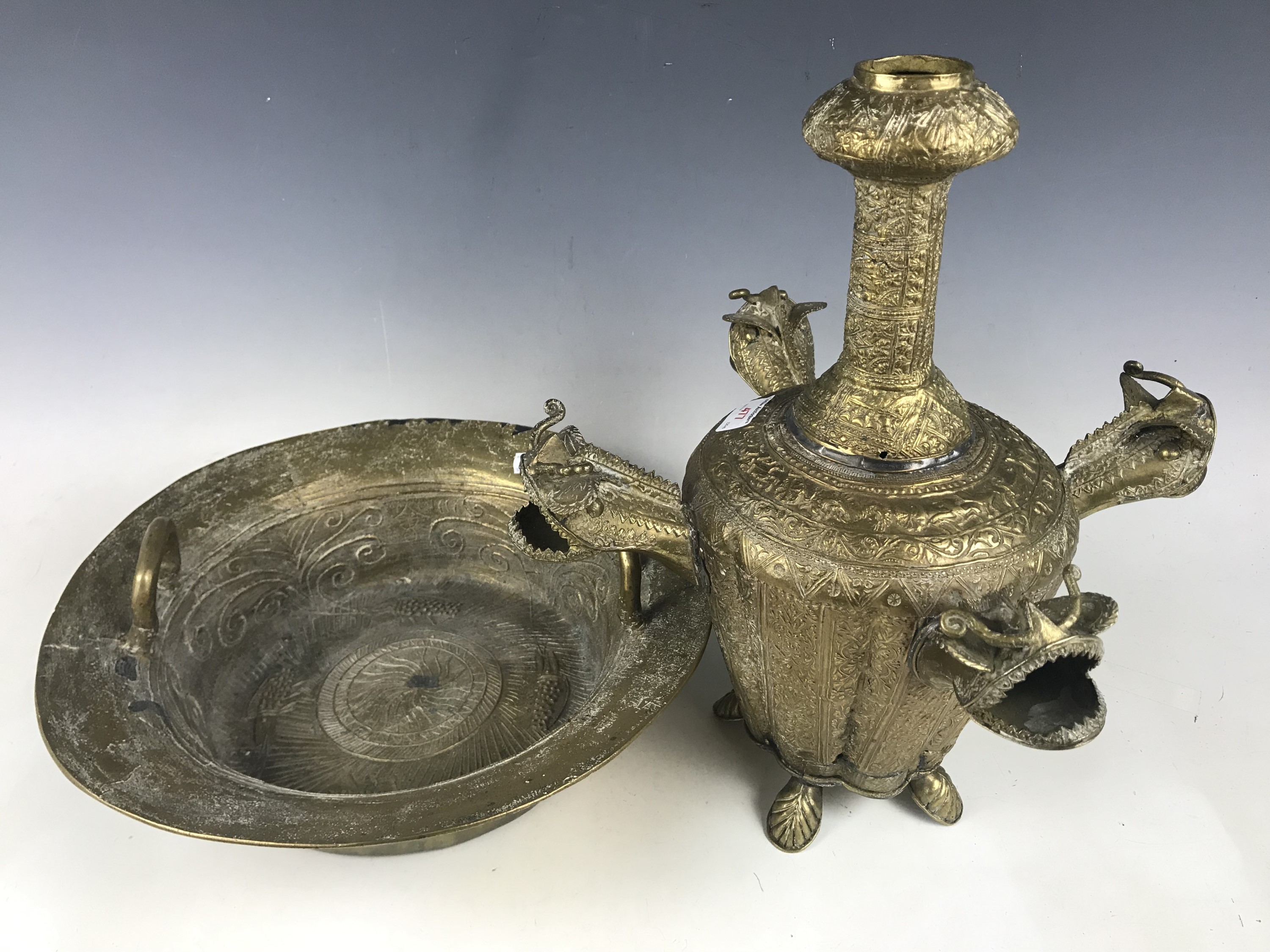 Two items of oriental / Middle Eastern brass including a multi-spouted lamp / vessel