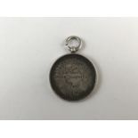 A military silver fob medallion engraved 153 Infantry brigade Highland gathering cross country race,