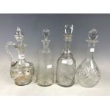 Three glass decanters including a hand enamelled example
