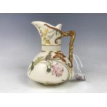 A Royal Worcester blush ivory jug, 14 cm (a/f)