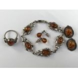 A contemporary white-metal and copal amber demi-parure, comprising bracelet, stud earrings,
