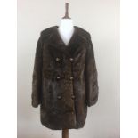 A 1960s lady's double-breasted beaver fur coat retailed by Fenwick's of Newcastle's 'French