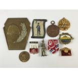 Sundry items of military insignia etc including a 1930s Czech plaque, Soviet badges, and a Great War
