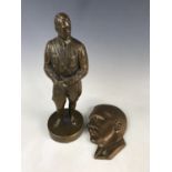 A cast brass statue of Hitler, together with a relief portrait plaque