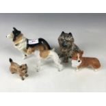 A Border Fine Arts corgi and lurcher figurine together with two Sylvac dogs and a Beswick figure