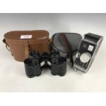 A cased pair of Le Maitre of Paris binoculars together with a Bolex Paillard cine camera
