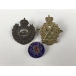 A Scottish Horse cap badge together with a white-metal lapel badge for the South-East London